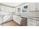 Bright kitchen with white cabinets, granite countertops, stainless steel appliances and subway tile backsplash at 287 Young Sw Ave, Concord, NC 28025