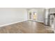 Open-concept living space with hardwood floors, stainless steel appliances, and natural light at 287 Young Sw Ave, Concord, NC 28025