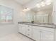 Bathroom with double vanity, granite countertops, and a glass-enclosed shower at 833 River Park Rd, Belmont, NC 28012