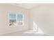 Bright bedroom with large window offering outside views and carpet flooring at 833 River Park Rd, Belmont, NC 28012