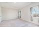 Bright bedroom with neutral carpeting and two large windows at 833 River Park Rd, Belmont, NC 28012