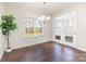 Bright dining room with hardwood floors and backyard access at 833 River Park Rd, Belmont, NC 28012