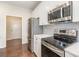 Modern kitchen with stainless steel appliances and white cabinets at 833 River Park Rd, Belmont, NC 28012