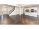 Bright and airy living room with hardwood floors, staircase, and open concept design at 833 River Park Rd, Belmont, NC 28012