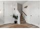 Staircase with carpet runner and simple white walls at 12502 Stonebriar Ridge Dr, Davidson, NC 28036