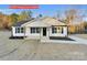 Newly constructed home with white siding, a covered porch, and landscaping at 1316 Carmel Rd, Lancaster, SC 29720