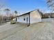 White house exterior with a deck and wooded view at 1316 Carmel Rd, Lancaster, SC 29720