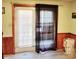 Back door featuring a small window, blinds and sheer curtains, leading to outdoor space and natural light at 2040 Ne 25Th Street Dr, Hickory, NC 28601