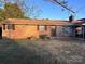 Charming brick front exterior with well-maintained lawn, mature trees, and a welcoming front porch at 2040 Ne 25Th Street Dr, Hickory, NC 28601