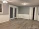 Living room featuring new flooring, neutral colors, and access to the outdoors at 2040 Ne 25Th Street Dr, Hickory, NC 28601