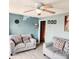 Comfortable living room featuring neutral tones, ceiling fan, and modern flooring at 2040 Ne 25Th Street Dr, Hickory, NC 28601