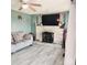 Cozy living room featuring a stone fireplace, ceiling fan, and modern flooring at 2040 Ne 25Th Street Dr, Hickory, NC 28601