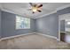 Well-lit bedroom with neutral walls and carpet at 3657 Norman View Dr, Sherrills Ford, NC 28673