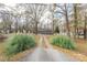 Long driveway leading to a gray house on a wooded lot at 4477 Pinebrook Dr, Rock Hill, SC 29730