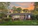 Charming brick home with well-manicured lawn and colorful landscaping, creating inviting curb appeal at 5431 Park Rd, Charlotte, NC 28209