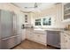 Charming kitchen with stainless appliances, farmhouse sink, and granite countertops at 5431 Park Rd, Charlotte, NC 28209