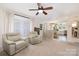 Open-concept living room with plush seating and seamlessly connected to the kitchen at 5431 Park Rd, Charlotte, NC 28209
