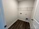 Laundry room with wire shelving and vinyl flooring at 588 N Sparkleberry Ln, Chester, SC 29706