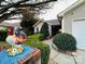 Inviting home exterior with lush greenery, a well-maintained lawn, and a bright, cheerful ambiance at 8430 Stoneman Pl, Charlotte, NC 28217