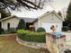 Charming home featuring a cozy front porch, neutral siding, and a well-manicured lawn at 8430 Stoneman Pl, Charlotte, NC 28217