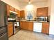Updated kitchen featuring stainless steel appliances and neutral countertops at 8430 Stoneman Pl, Charlotte, NC 28217
