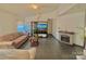 Comfortable living room featuring tile flooring, a cozy fireplace, and plenty of natural light at 8430 Stoneman Pl, Charlotte, NC 28217
