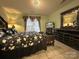 Comfortable bedroom featuring tile floors, natural light, and modern furniture at 8430 Stoneman Pl, Charlotte, NC 28217