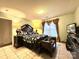 This main bedroom features a queen bed, fresh paint, tile floor and a dark wooden bed frame at 8430 Stoneman Pl, Charlotte, NC 28217