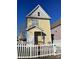 Rear view of a yellow house with white picket fence at 104 Kensington St, Mooresville, NC 28117