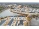 An aerial view shows a well-planned community next to a lake, featuring tidy streets and modern homes at 2409 Fathom Way, Charlotte, NC 28269