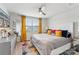 Bright primary bedroom with large window, stylish decor, ceiling fan and plenty of natural light at 2409 Fathom Way, Charlotte, NC 28269