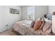 Cozy bedroom with neutral tones, a bright window, and soft pillows for a relaxing retreat at 2409 Fathom Way, Charlotte, NC 28269