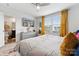 Spacious primary bedroom featuring a ceiling fan, dresser, large window, and a relaxing atmosphere at 2409 Fathom Way, Charlotte, NC 28269