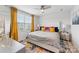 Inviting primary bedroom with large window, ceiling fan and stylish decor and plenty of natural light at 2409 Fathom Way, Charlotte, NC 28269