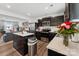 Well-equipped kitchen featuring stainless steel appliances, dark cabinets, and a functional center island at 2409 Fathom Way, Charlotte, NC 28269