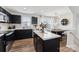 Contemporary kitchen featuring sleek black cabinets, stainless steel appliances, and marble countertops at 2409 Fathom Way, Charlotte, NC 28269