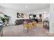 Open concept living room featuring stylish decor, comfortable seating, and seamlessly connected kitchen at 2409 Fathom Way, Charlotte, NC 28269