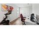 A home office with exercise equipment, a desk, and a door to the exterior at 2409 Fathom Way, Charlotte, NC 28269