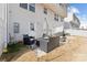 Cozy patio with outdoor seating and a grill, an exterior door, and a well-maintained yard for relaxation and entertainment at 2409 Fathom Way, Charlotte, NC 28269