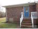 Brick house with blue back door and steps at 31655 Pinewood Dr, New London, NC 28127