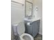 Clean bathroom with gray vanity and modern fixtures at 31655 Pinewood Dr, New London, NC 28127