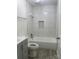 Renovated bathroom, featuring a bathtub and gray vanity at 31655 Pinewood Dr, New London, NC 28127