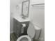 Modern bathroom with gray vanity and hexagon accents at 31655 Pinewood Dr, New London, NC 28127