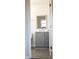 Bathroom with gray vanity and a mirror at 31655 Pinewood Dr, New London, NC 28127