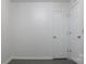 Simple bedroom with gray flooring and a window at 31655 Pinewood Dr, New London, NC 28127