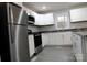 Modern kitchen with stainless steel appliances and an island at 31655 Pinewood Dr, New London, NC 28127