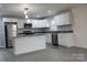 Modern kitchen with stainless steel appliances and an island at 31655 Pinewood Dr, New London, NC 28127