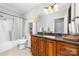 bathroom with granite countertop and a tub shower combo at 404 Yorkfield Dr, Shelby, NC 28150