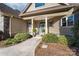 Close up of a charming front entrance with manicured landscaping and covered porch at 404 Yorkfield Dr, Shelby, NC 28150
