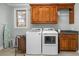 Laundry room with washer, dryer, and upper cabinets at 404 Yorkfield Dr, Shelby, NC 28150